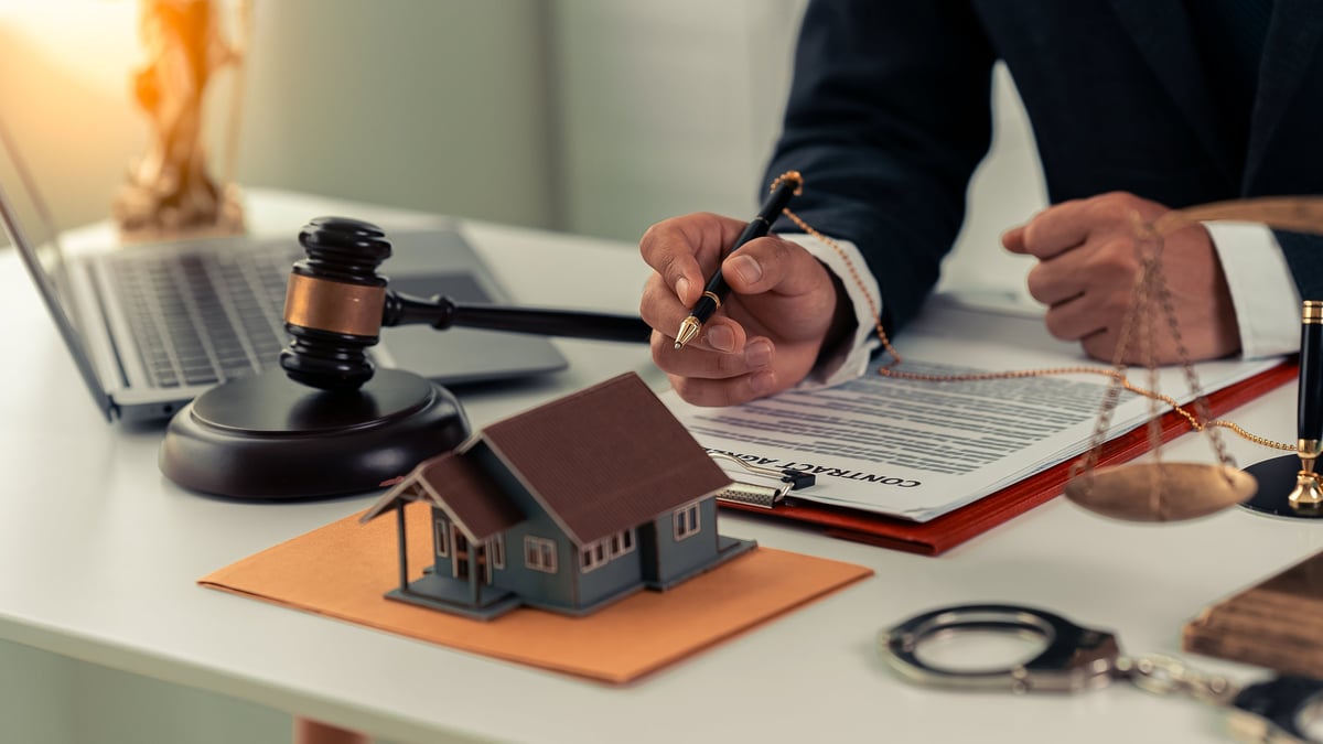 Justin Gaspard working on real estate contracts